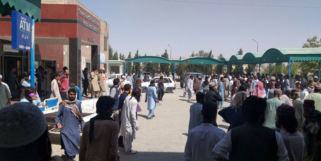 People gather outside the Mastung hospital, following the deadly attack, on September 29, 2023.