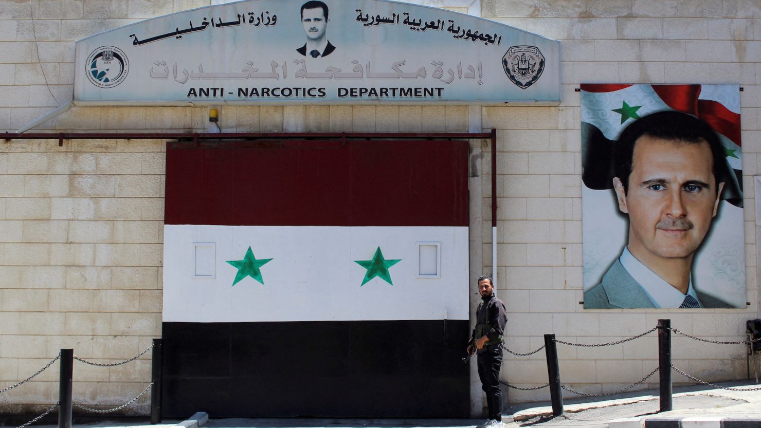 A security personnel stands at the gate of Syrian Interior Ministry's anti-narcotics department in Damascus, Syria  June 14.