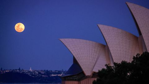 The full moon, a supermoon also known as the "Harvest Moon", rises above Macquarie Lighthouse and the Sydney Opera House in Sydney on September 29, 2023. (Photo by DAVID GRAY / AFP) (Photo by DAVID GRAY/AFP via Getty Images)