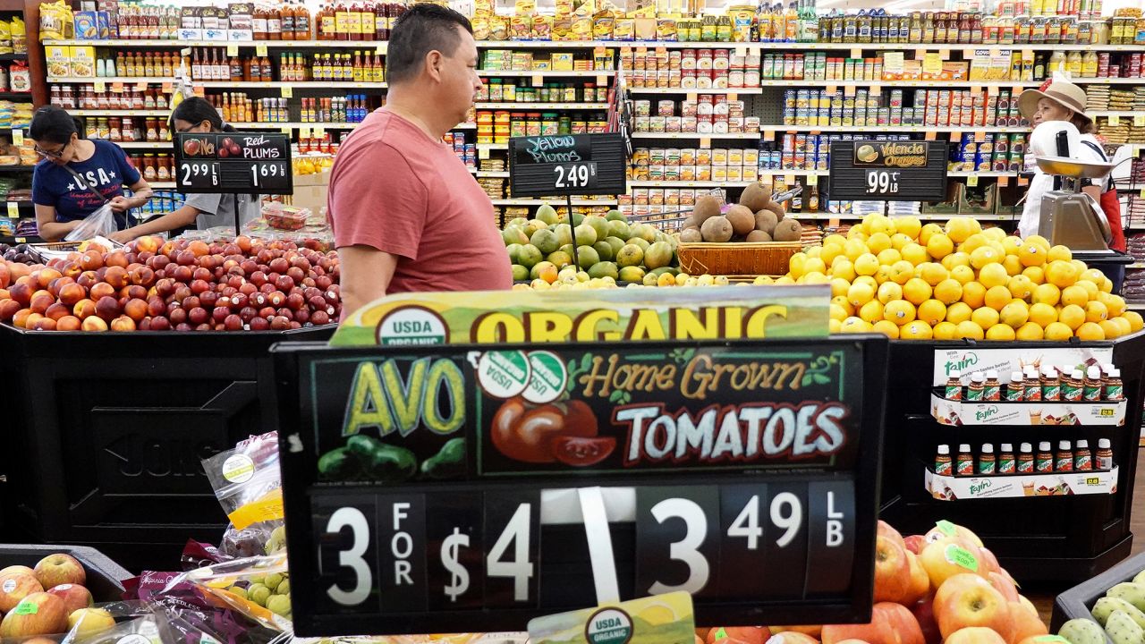People shop in the produce section of a grocery store on September 12, 2023 in Los Angeles, California. 