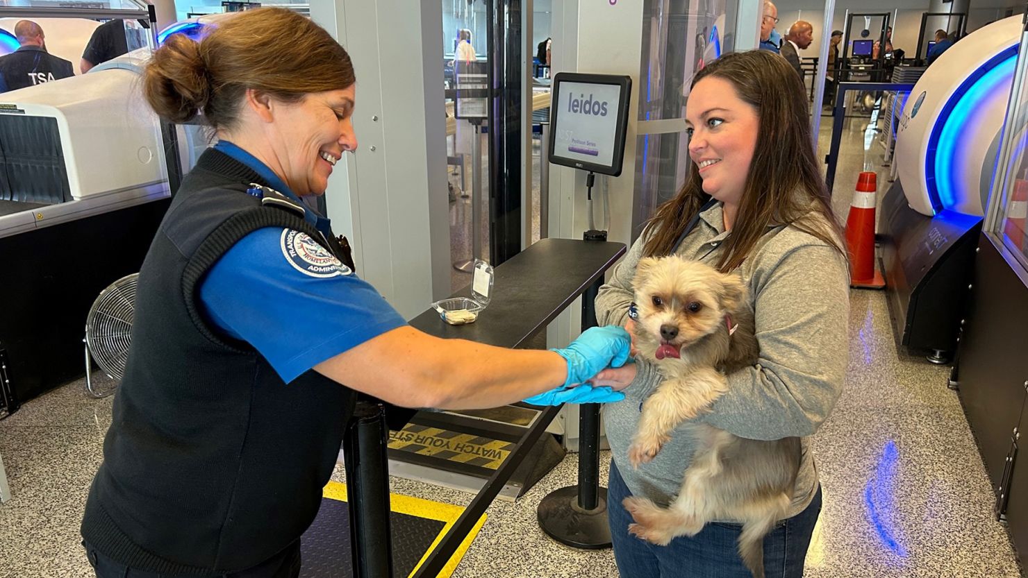 Transportation Security Officer Julie Schwallie performs a pet screening demonstration at Buffalo Niagara International Airport.