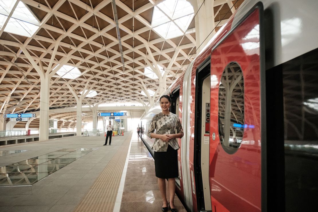 A staff member waits for passengers to board the Jakarta-Bandung high-speed train during a week-long public trial phase at the Halim station in Jakarta on September 17, 2023.