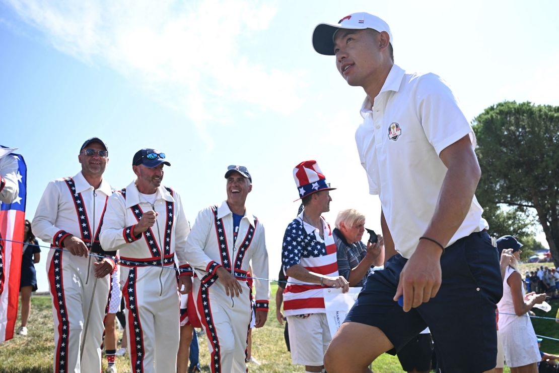 US golfer, Collin Morikawa passes a group of Team US fans dressed as Evel Knievel as he leaves the 10th green during practice ahead of the 44th Ryder Cup at the Marco Simone Golf and Country Club in Rome on September 28, 2023. (Photo by Paul ELLIS / AFP) (Photo by PAUL ELLIS/AFP via Getty Images)