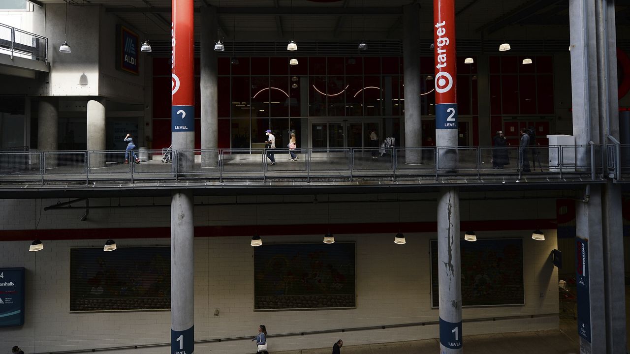 People walk past the Target store in East Harlem in the East River Plaza mall.