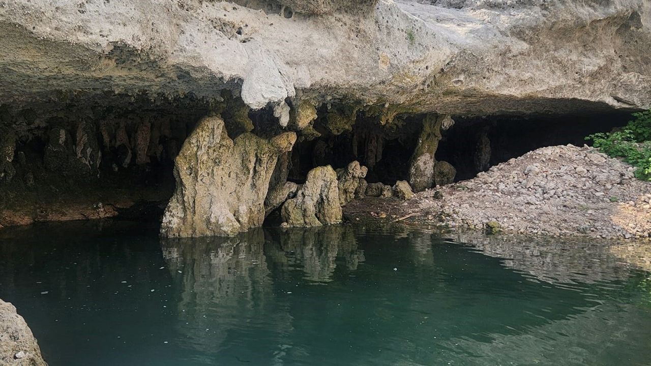 This cave, which is typically underwater at Canyon Lake, appeared as Texas has suffered extreme heat and little rain over the summer.