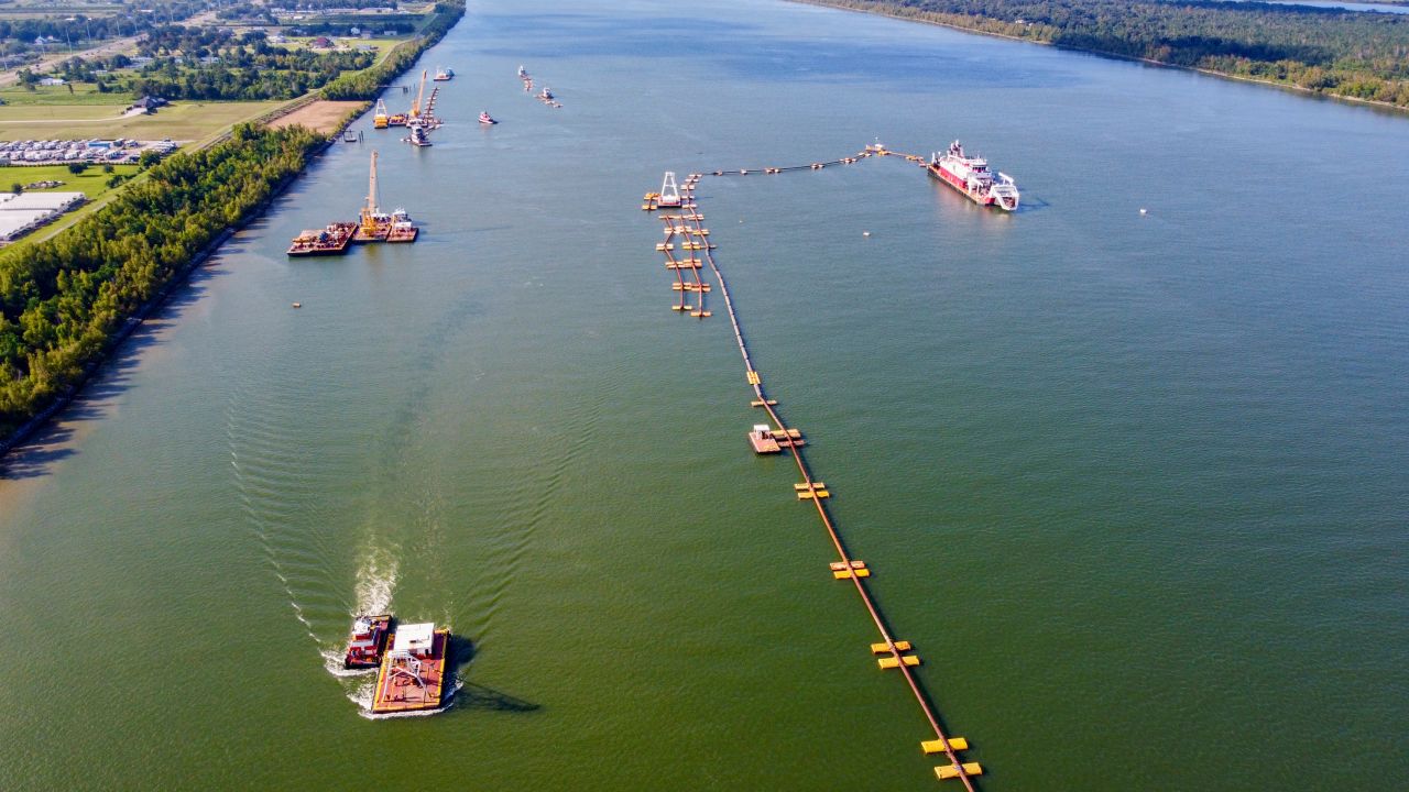 U.S. Army Corps of Engineers crews use dredges and pipes to move silt onto an underwater sill along the bottom of the Mississippi River on Friday, Sept. 22, 2023, about 20 miles downriver from New Orleans. The sill aims to keep saltwater from the Gulf of Mexico from moving upriver. (Chris Granger/The Times-Picayune/The New Orleans Advocate via AP)