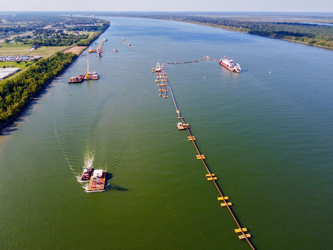 US Army Corps of Engineers crews use dredges and pipes to move silt onto an underwater sill at the bottom of the Mississippi River, about 20 miles downriver from New Orleans. The sill aims to keep saltwater from the Gulf of Mexico from moving upriver.
