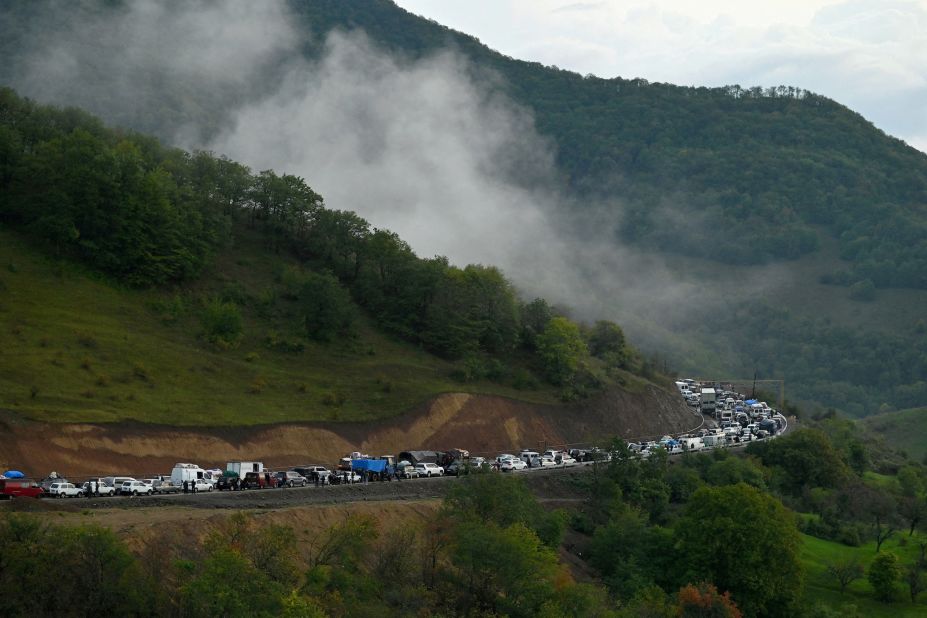 Vehicles carrying people leaving Nagorno-Karabakh queue on the road leading towards the Armenian border September 25.