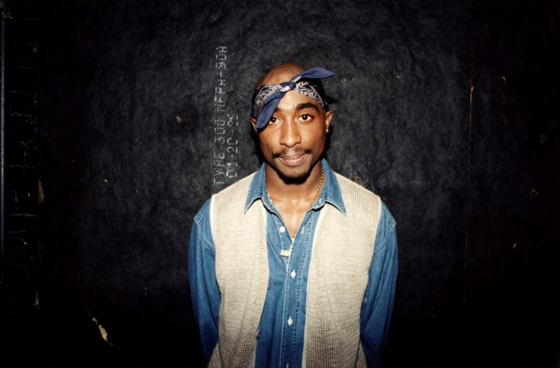 Rapper Tupac Shakur poses for photos backstage after his performance at the Regal Theater in Chicago, Illinois, in March 1994. 