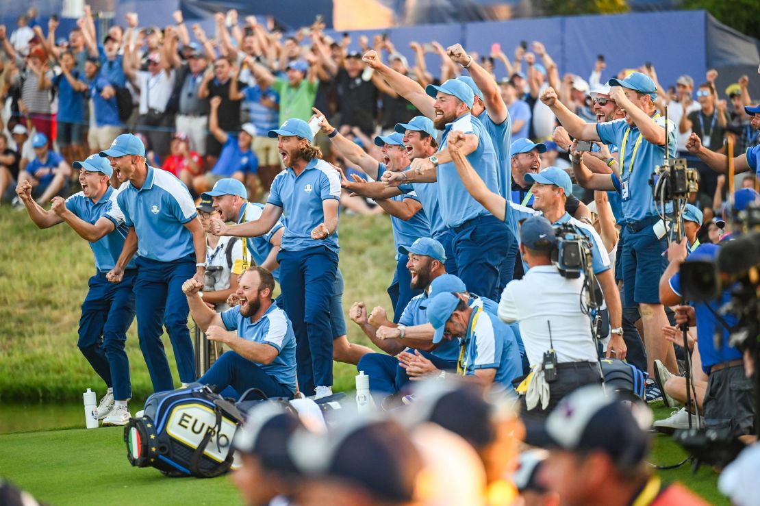 ROME, ITALY - SEPTEMBER 29:  Team Europe players, from left, Matthew Fitzpatrick, Nicolai Hojgaard, Tyrrell Hatton, Tommy Fleetwood, Rory McIlroy, Viktor Hovland, Shane Lowry and Jon Rahm celebrate as teammate Justin Rose makes a putt on the 18th hole green to halve his match during Friday afternoon four-ball matches of the 2023 Ryder Cup at Marco Simone Golf Club on September 29, 2023 in Rome, Italy. (Photo by Keyur Khamar/PGA TOUR via Getty Images)