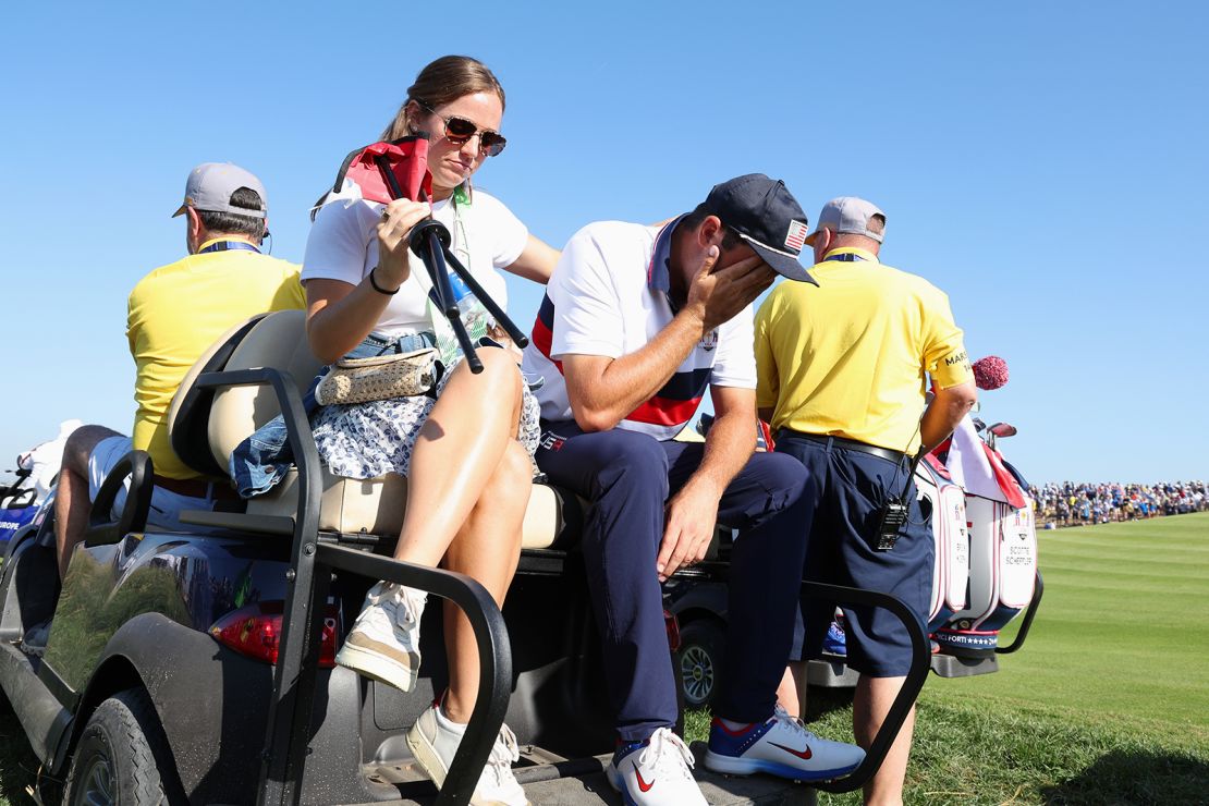 Scottie Scheffler of Team United States is consoled by his Wife, Meredith Scheffler after losing his match to Viktor Hovland and Ludvig Aberg of Team Europe (not pictured) 9&7 during the Saturday morning foursomes matches of the 2023 Ryder Cup at Marco Simone Golf Club on September 30, 2023 in Rome, Italy.