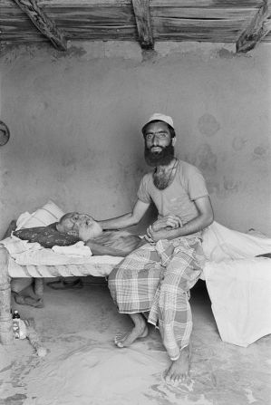 This photo taken by Gill depicts Mir Hasan with his grandfather, Haji Saraj ud Din, the oldest member of the community, in his last days.
