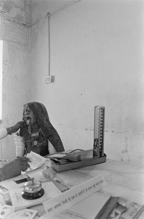 Gill took this image of a woman undergoing a medical examination and named it "Government Hospital, Barmer."
