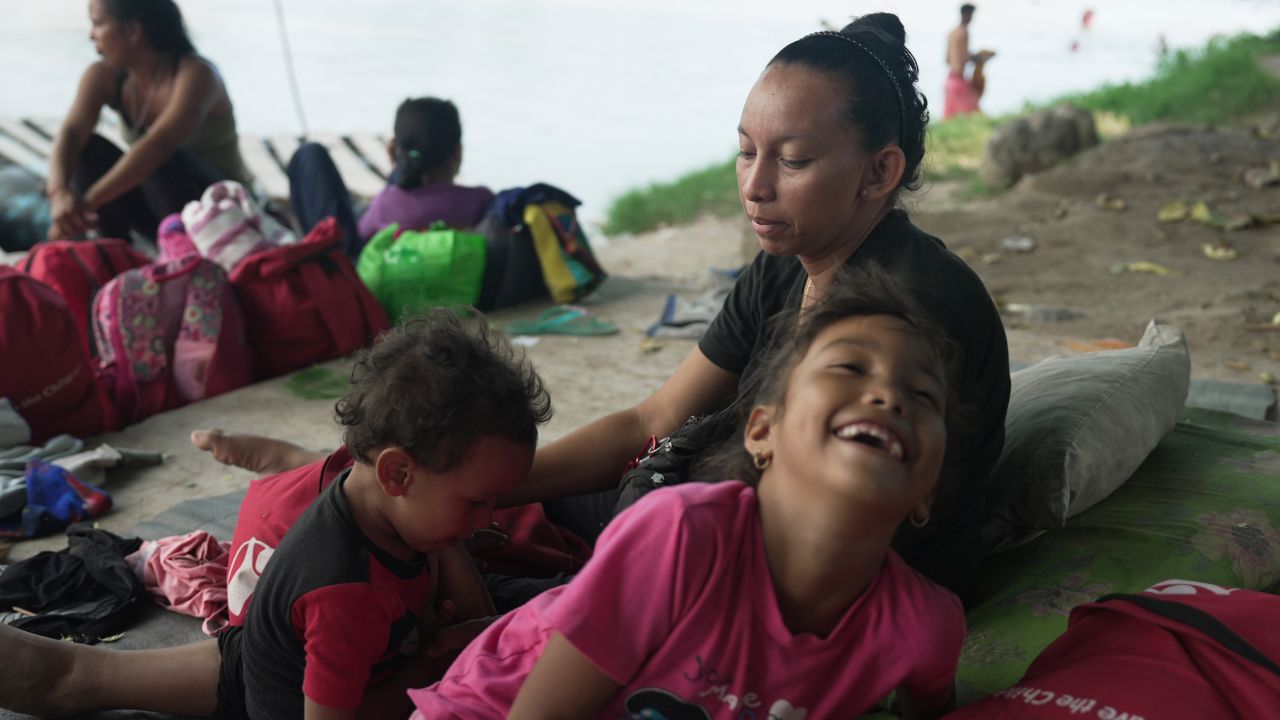 Susana watches her children in a makeshift encampment in Ciudad Hidalgo. Her family is trying to earn some money before continuing north towards the United States.