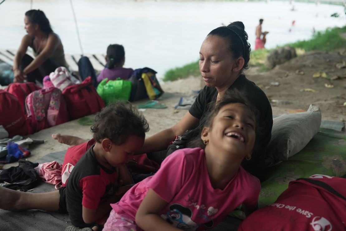 Susana watches her children in a makeshift encampment in Ciudad Hidalgo. Her family is trying to earn some money before continuing north towards the United States.