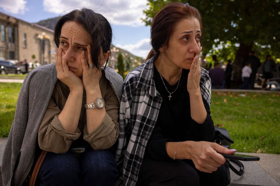 Greta and Marieta wait to reunite with relatives after arriving in Goris on September 27.