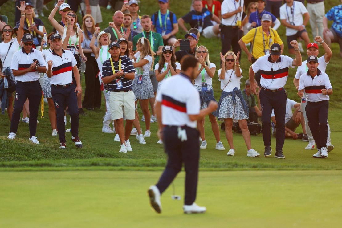 ROME, ITALY - SEPTEMBER 30: Team United States celebrates on the 17th green as Patrick Cantlay of Team United States (obscured) holes his putt during the Saturday afternoon fourball matches of the 2023 Ryder Cup at Marco Simone Golf Club on September 30, 2023 in Rome, Italy. (Photo by Andrew Redington/Getty Images)