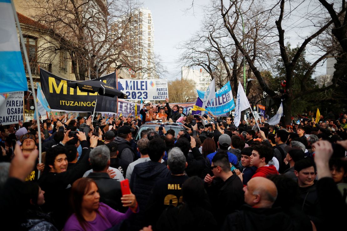 Argentine presidential candidate Javier Milei for La Libertad Avanza coalition gestures next to Carolina Piparo, candidate for Governor of the Province of Buenos Aires, during a campaign rally in La Plata, Buenos Aires on September 12.