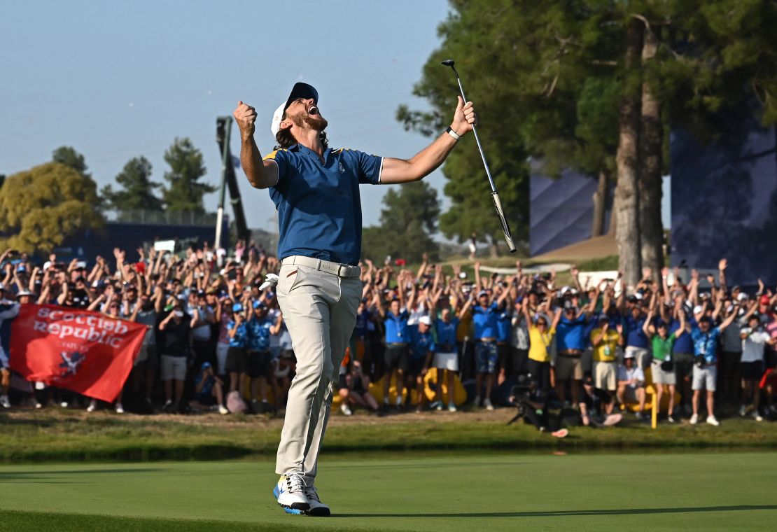 Europe's English golfer, Tommy Fleetwood celebrates the winning putt on the 17th green during his singles match against US golfer, Rickie Fowler on the final day of play in the 44th Ryder Cup at the Marco Simone Golf and Country Club in Rome on October 1, 2023.
