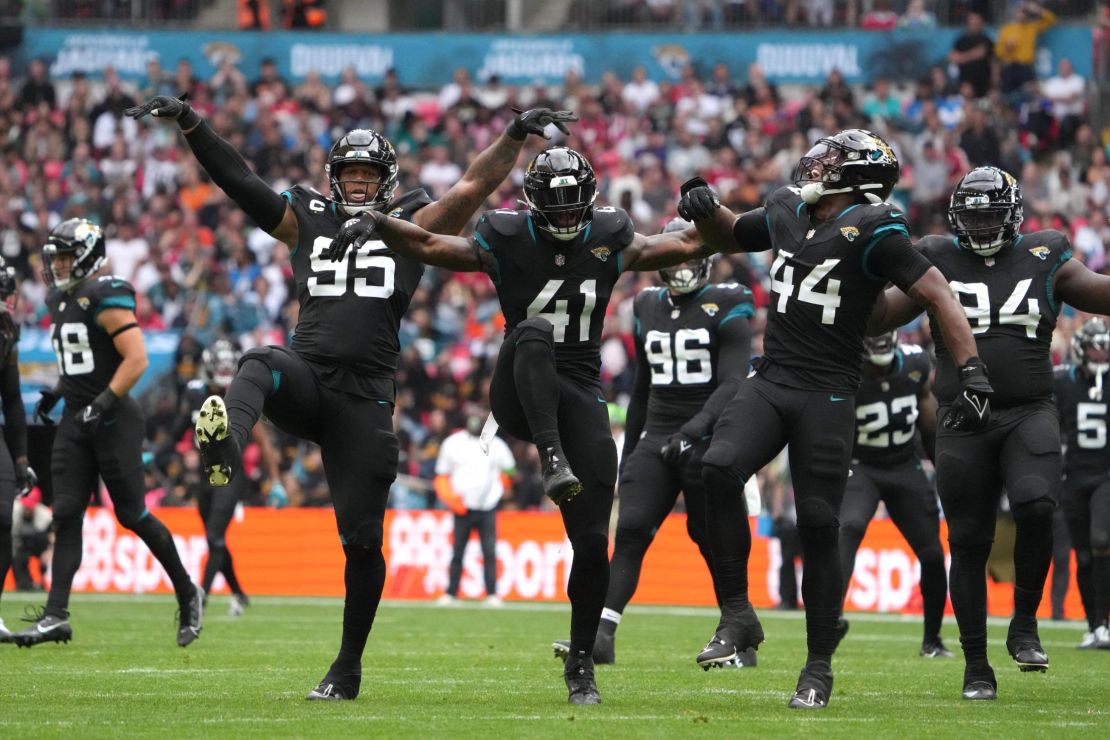 Oct 1, 2023; London, United Kingdom; Jacksonville Jaguars defensive end Roy Robertson-Harris (95), linebacker Josh Allen (41) and linebacker Travon Walker (44) celebrate against the Atlanta Falcons in the first half during an NFL International Series game at Wembley Stadium. Mandatory Credit: Kirby Lee-USA TODAY Sports
