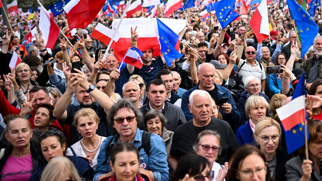 People waved Polish and EU flags at Sunday's rally.