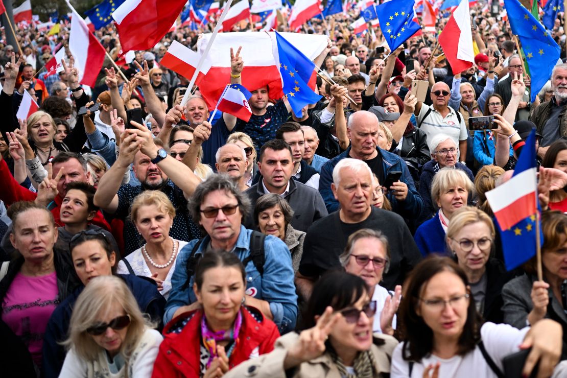 People waved Polish and EU flags at Sunday's rally.