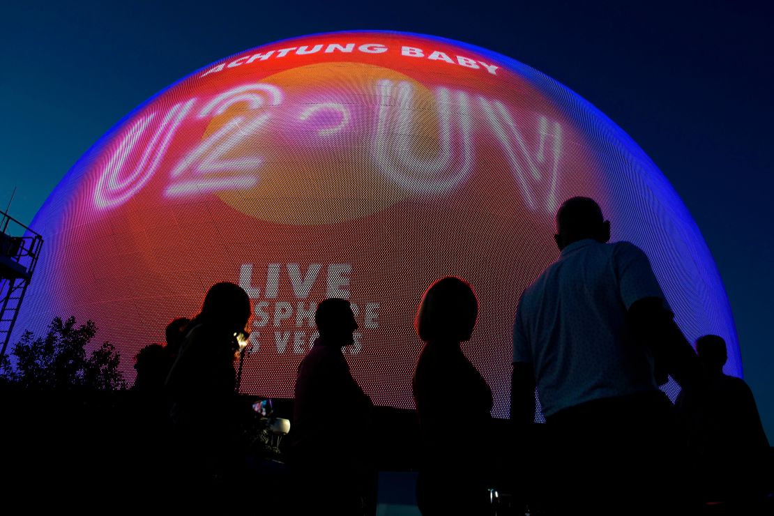 People arrive for the opening night of U2'S "UV Achtung Baby" show on Friday at the new Sphere venue in Las Vegas. 