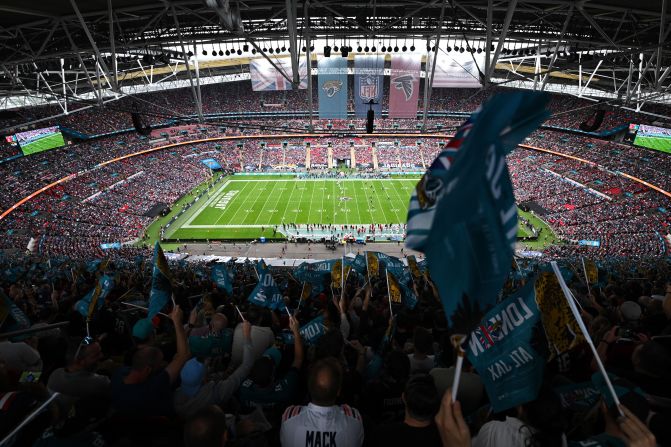 Jacksonville Jaguars fans wave flags ahead of a game against the Atlanta Falcons at Wembley Stadium in London on October 1. It was the first of five international games the NFL has scheduled this season as part of its ever-expanding International Series. The Jaguars won 23-7.