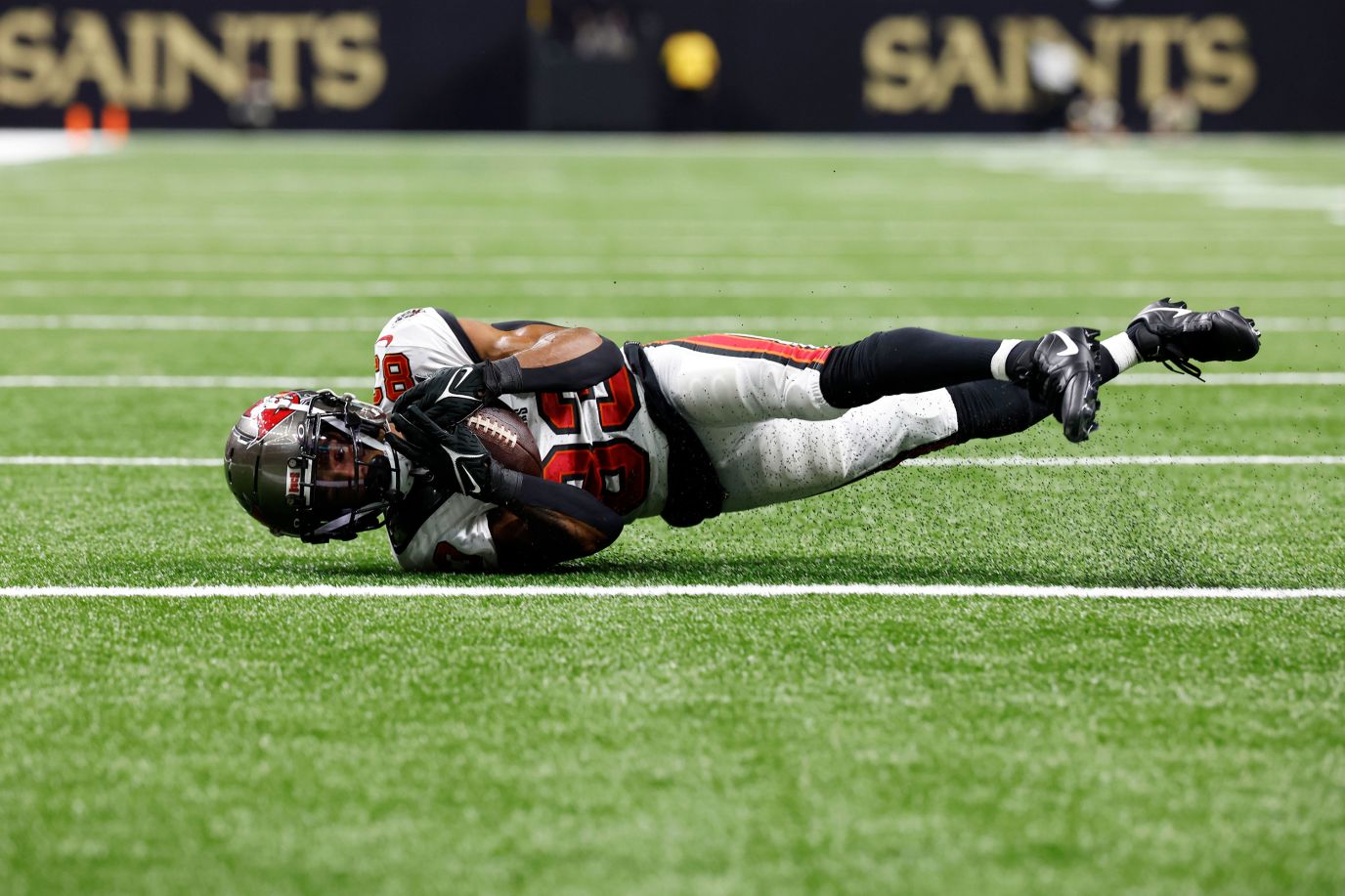 Deven Thompkins of the Tampa Bay Buccaneers carries the ball