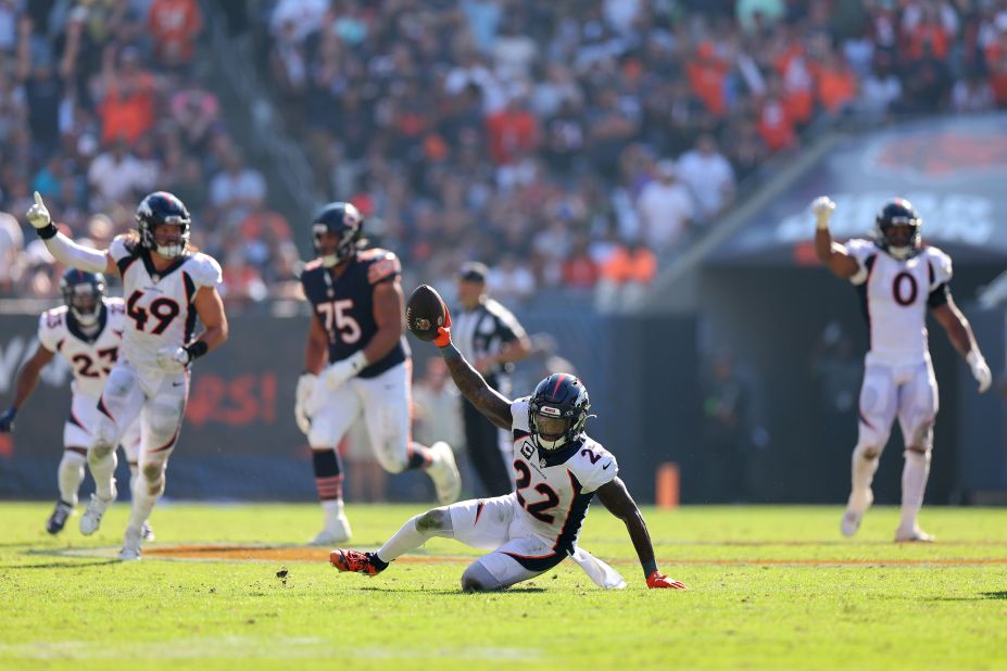 Kareem Jackson of the Denver Broncos celebrates intercepting a pass thrown by Chicago Bears quarterback Justin Fields. The Broncos won 31-28.