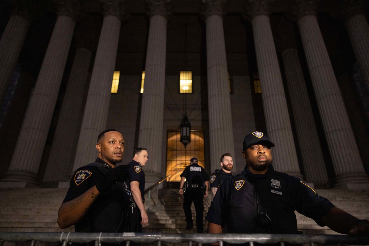 New York State Court Officers stand outside the New York Supreme Court on Monday.