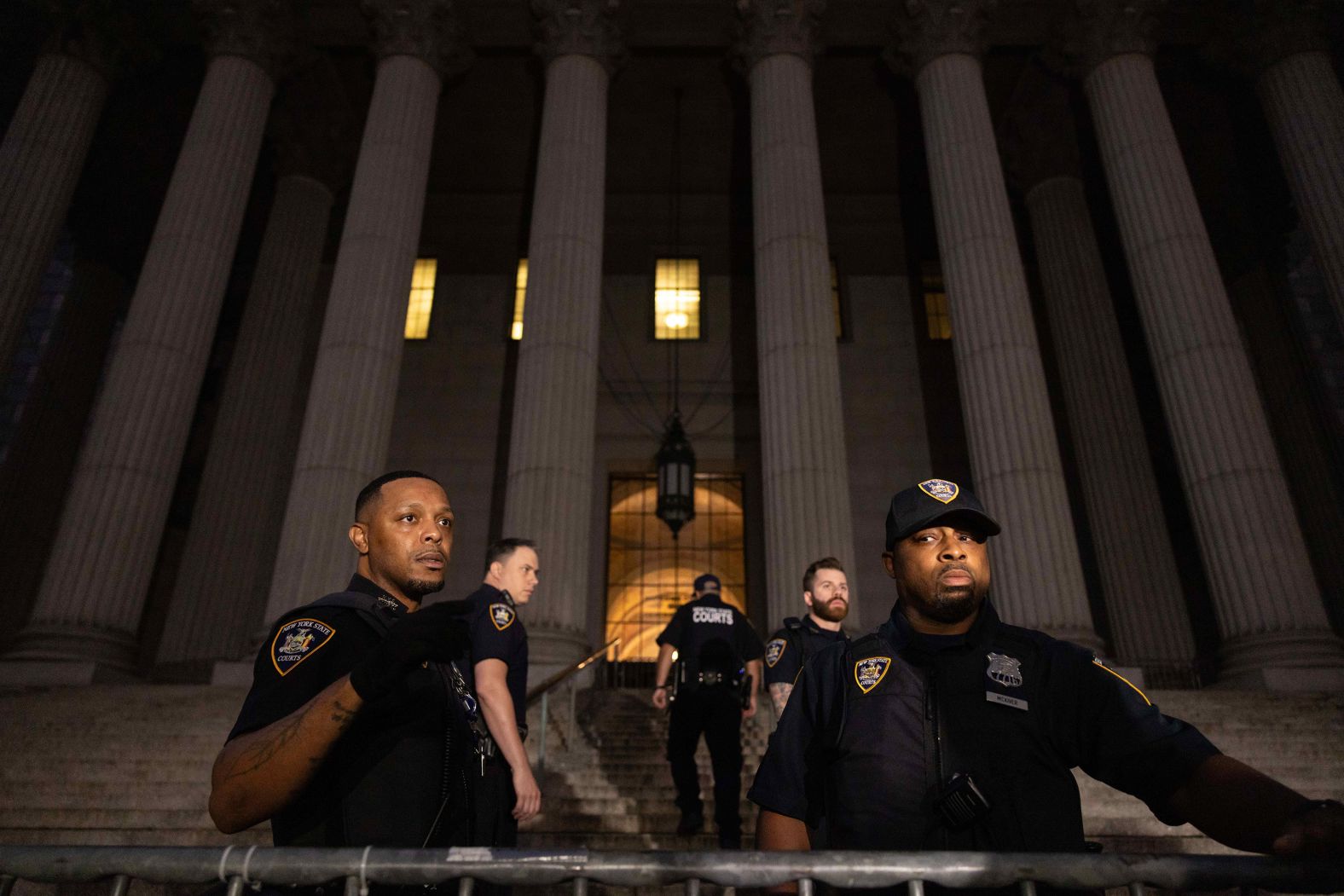 New York State Court Officers stand outside the New York Supreme Court on October 2.