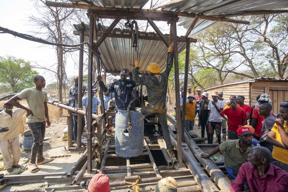 Artisanal miners are seen during a rescue mission at the collapsed mine shaft.