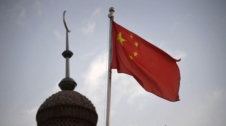 The Chinese flag flies over a mosque in Kashgar, Xinjiang in 2019. 