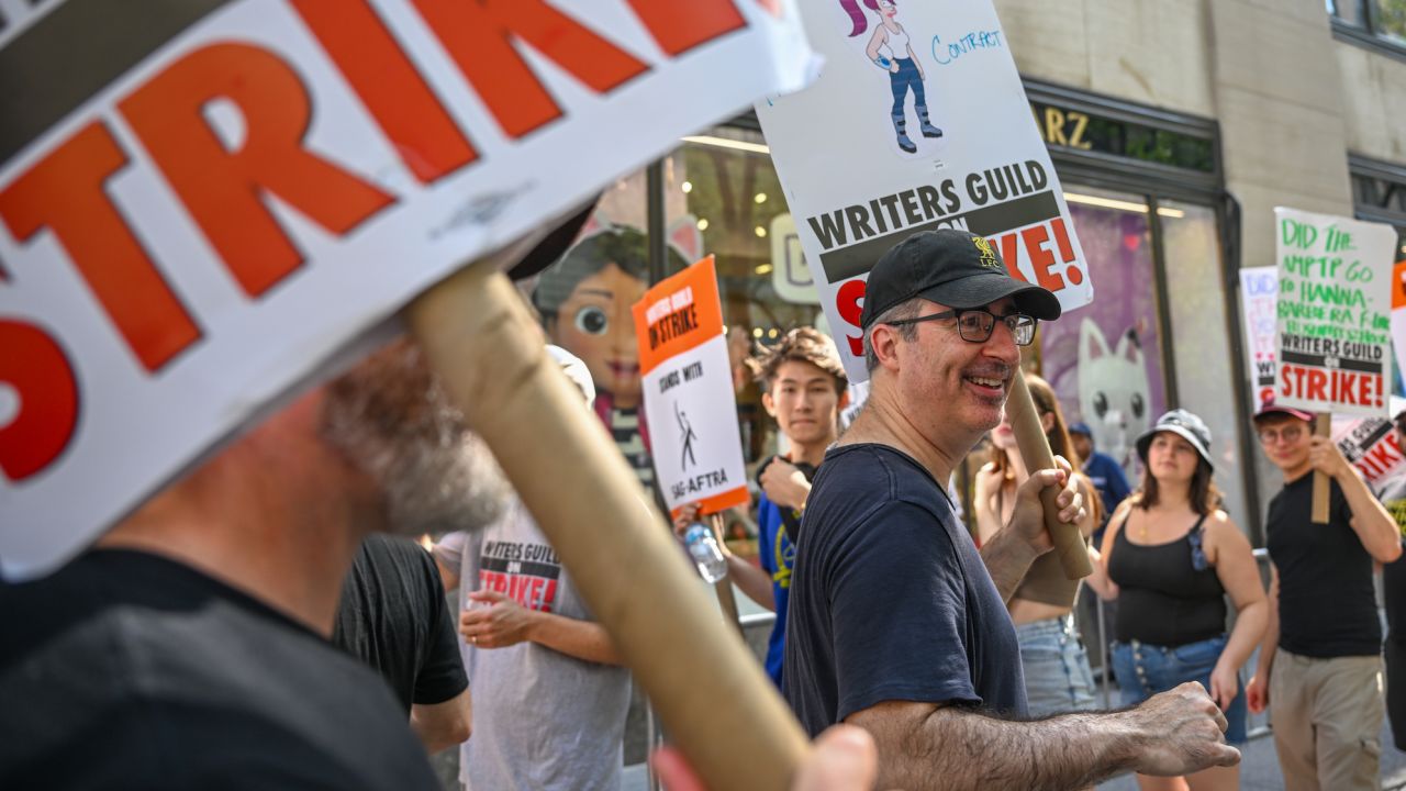 John Oliver joins Writers Guild of America East (WGA) to walk the picket line.