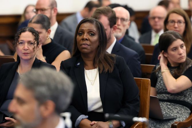 James, center, sits in the front row of the courtroom on October 2.