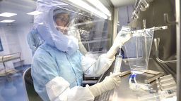 An employee of BioNTech works inside a laboratory at their COVID-19 vaccine production facility as the spread of the coronavirus disease (COVID-19) continues, in Marburg, Germany, March 27, 2021. Picture taken March 27, 2021. REUTERS/Kai Pfaffenbach