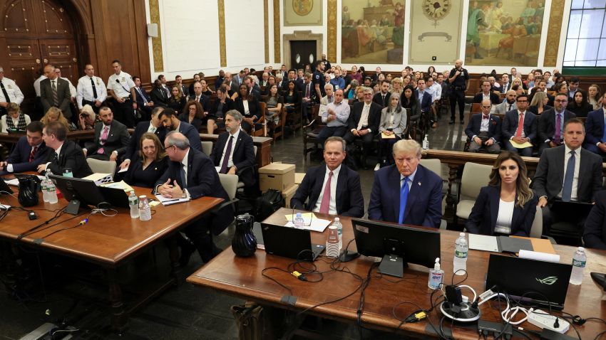 Trump and New York AG sit just feet apart in courtroom See the moment