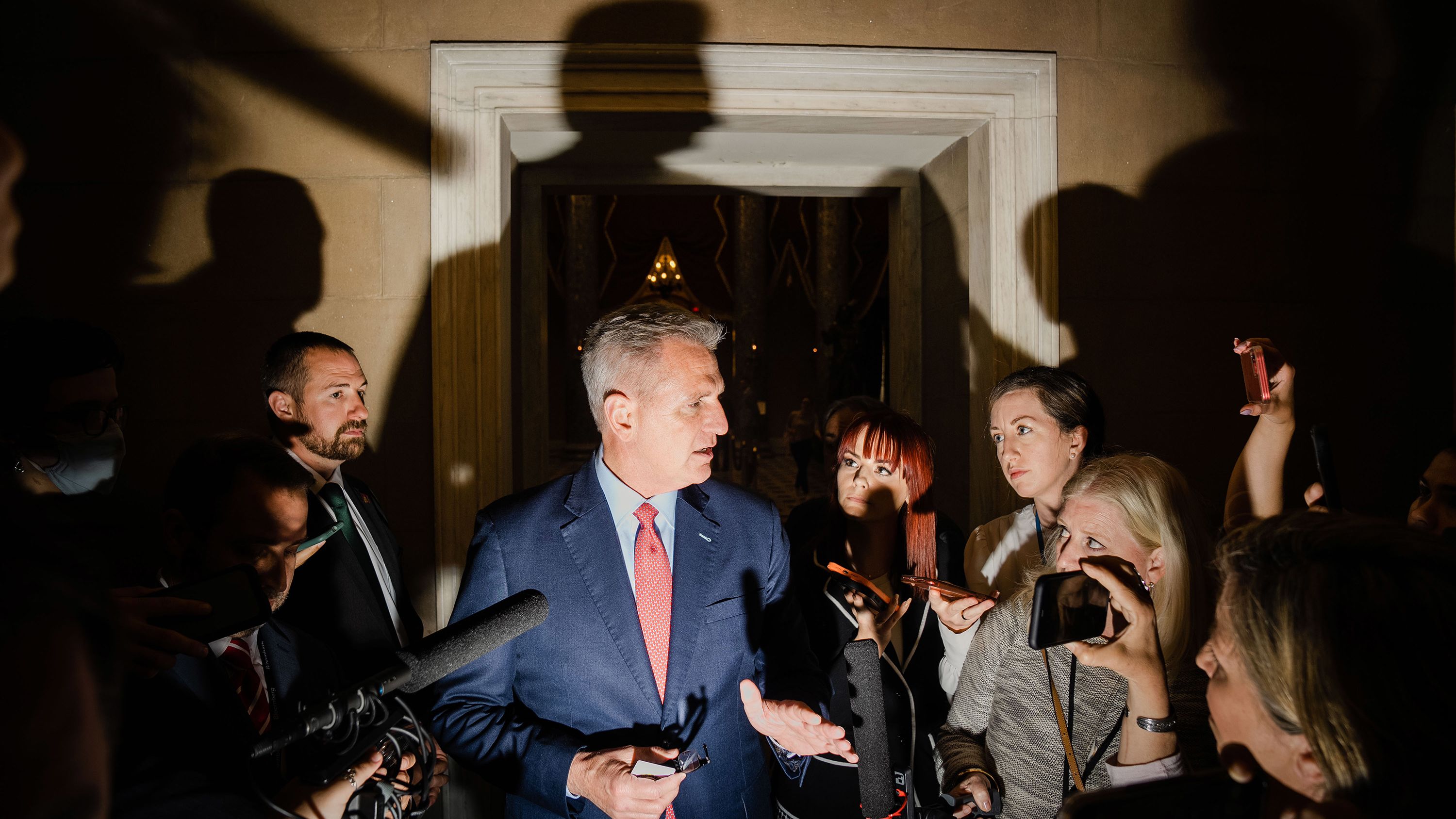McCarthy speaks with reporters as he leaves the House Chamber in May 2023.
