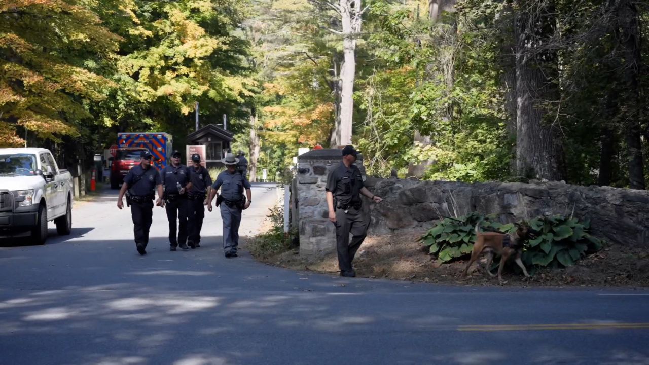 Law enforcement officers are seen at the site of the search for Charlotte Sena. 