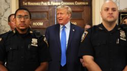 NEW YORK, NEW YORK - OCTOBER 02: Former US President Donald Trump speaks while the court takes a lunch recess during the first day of his civil fraud trial at New York State Supreme Court on October 02, 2023 in New York City. Former President Trump may be forced to sell off his properties after Justice Arthur Engoron canceled his business certificates after ruling that he committed fraud for years while building his real estate empire after being sued by Attorney General Letitia James, who is seeking $250 million in damages. The trial will determine how much he and his companies will be penalized for the fraud. (Photo by Michael M. Santiago/Getty Images)