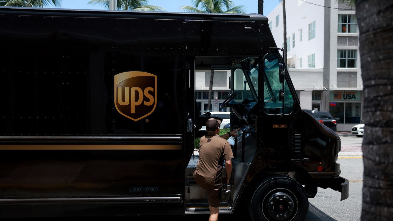 A UPS driver makes a delivery in Miami, which experienced its worst heat wave on record this summer.