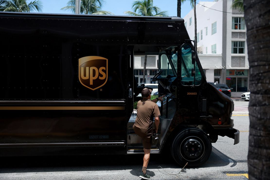 A UPS driver makes a delivery in Miami, which experienced its worst heat wave on record this summer.