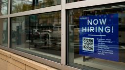 An employee hiring sign with a QR code is seen in a window of a business in Arlington, Virginia, U.S., April 7, 2023. REUTERS/Elizabeth Frantz