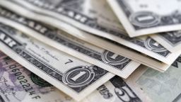 GERMANY - 2022/07/21: In this photo illustration, one and five dollar bills seen on display. (Photo Illustration by Igor Golovniov/SOPA Images/LightRocket via Getty Images)