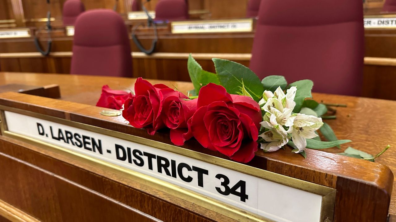 Roses rest on the Senate desk of late North Dakota Republican state Sen. Doug Larsen, at the state Capitol Monday, Oct. 2, 2023, in Bismarck, N.D. 