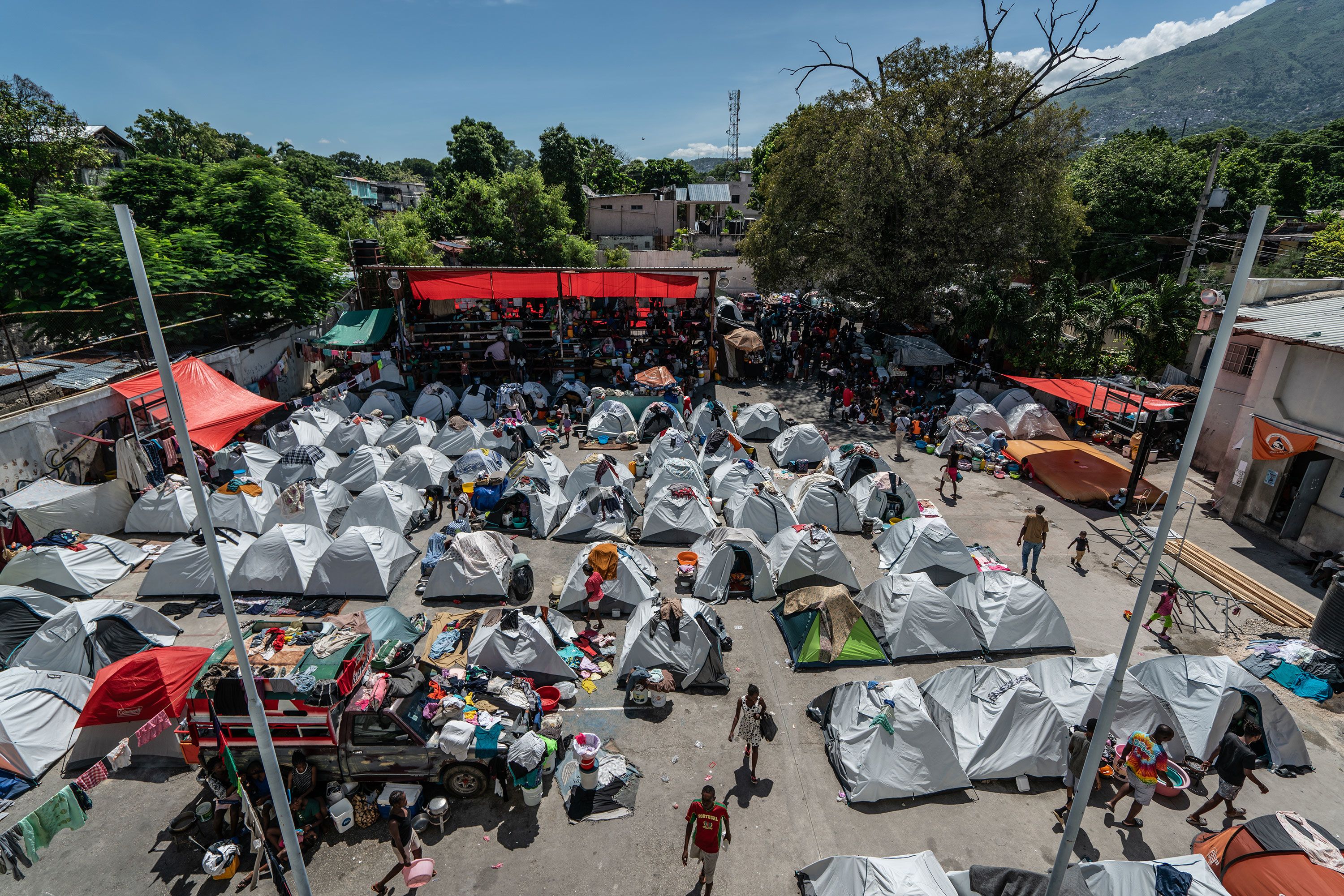 Tents are set up at the Gymnasium Vincent, a school and sports complex.