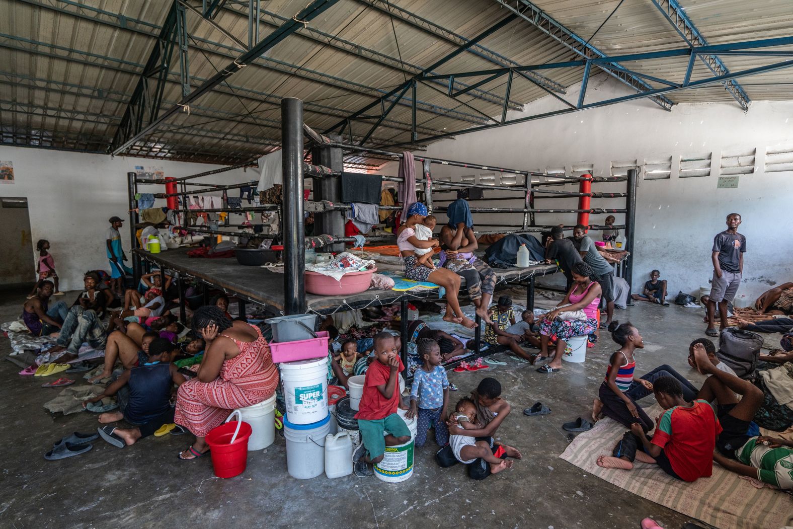 People take shelter at a boxing arena in downtown Port-au-Prince.