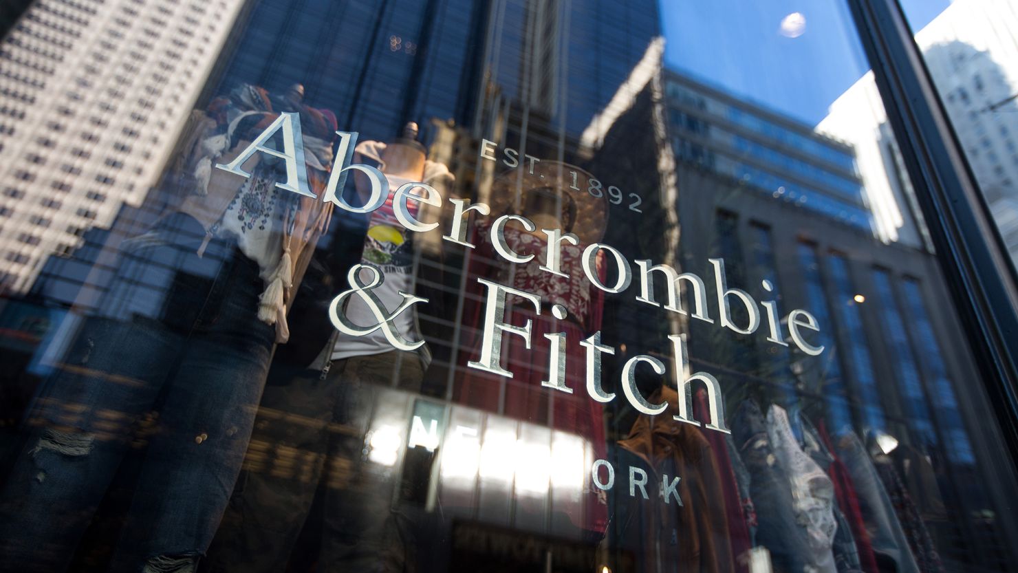 Abercrombie & Fitch Co. signage is displayed at the store on 5th Avenue in New York, U.S., on Sunday, Feb. 28, 2016. 