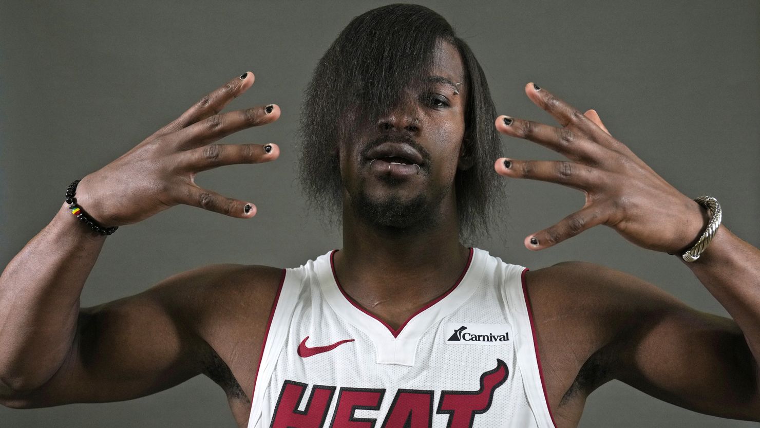 Miami Heat Forward Jimmy Butler poses for a photo during the NBA basketball team's media day, Monday, Oct. 2, 2023, in Miami. Butler had a new look for Media Day and the NBA world immediately took notice. (AP Photo/Wilfredo Lee)